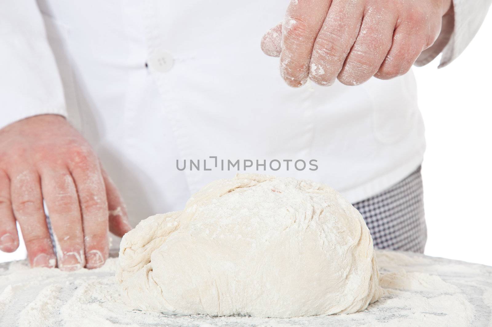 Baker kneading dough by kaarsten