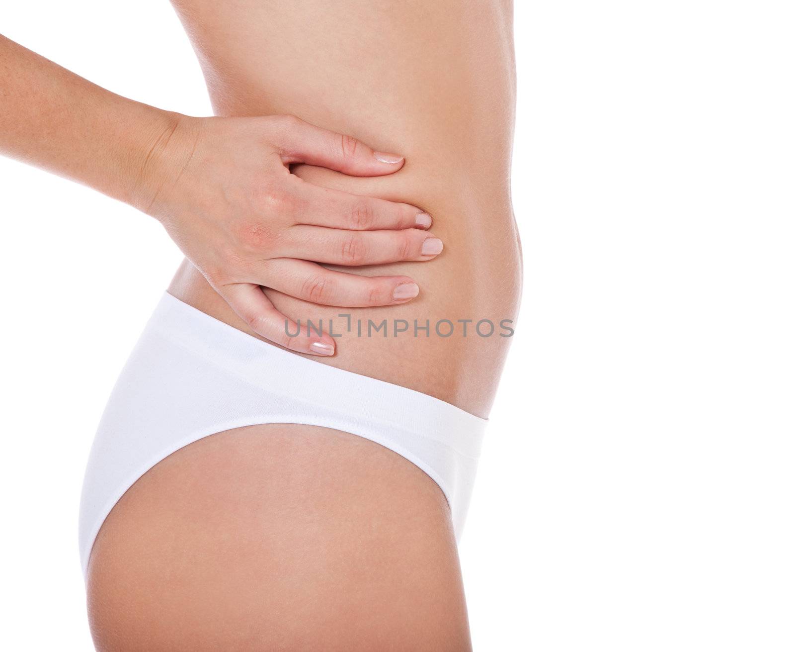 Attractive female person checking her skin. All on white background.