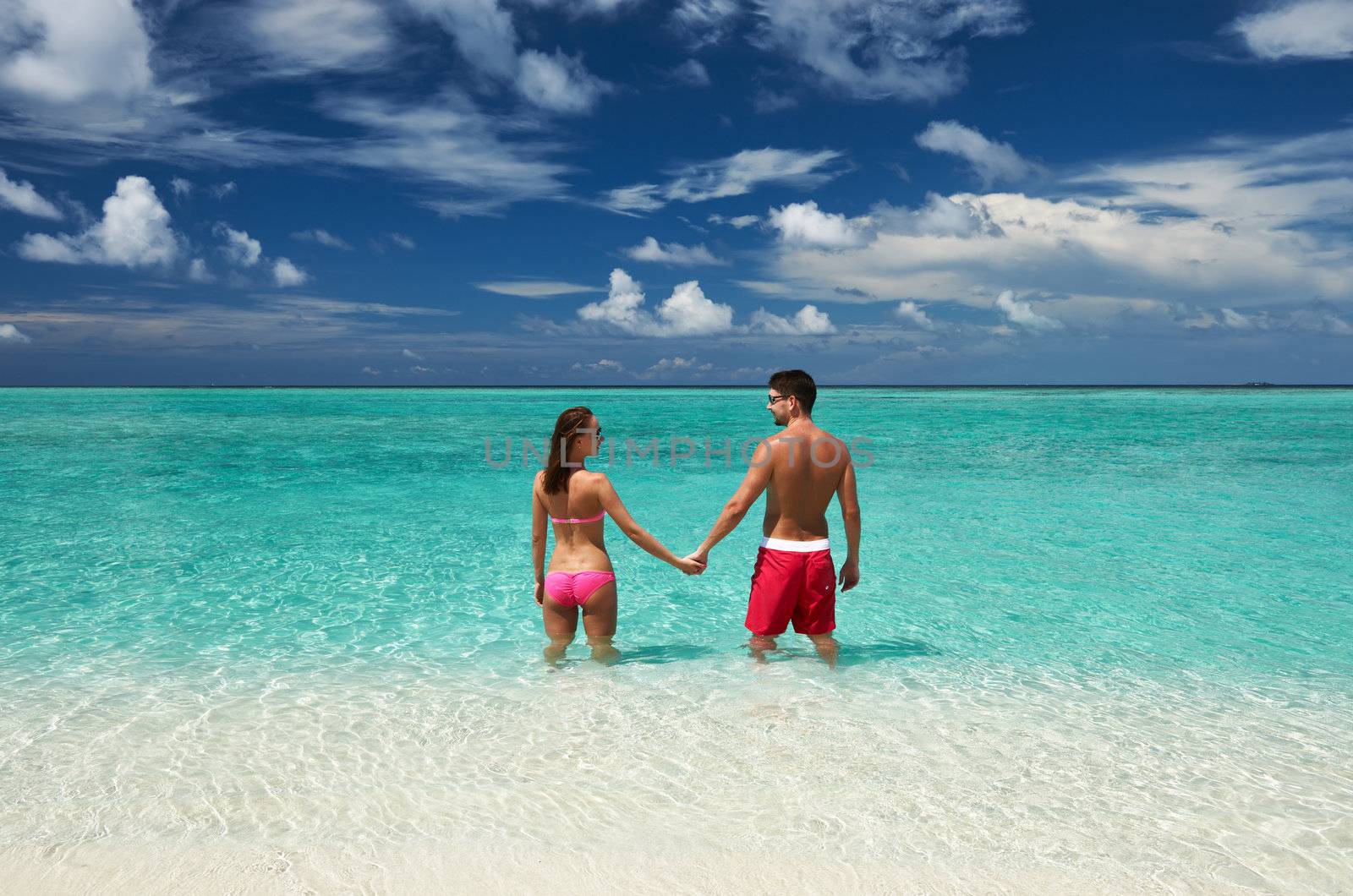 Couple on a tropical beach at Maldives