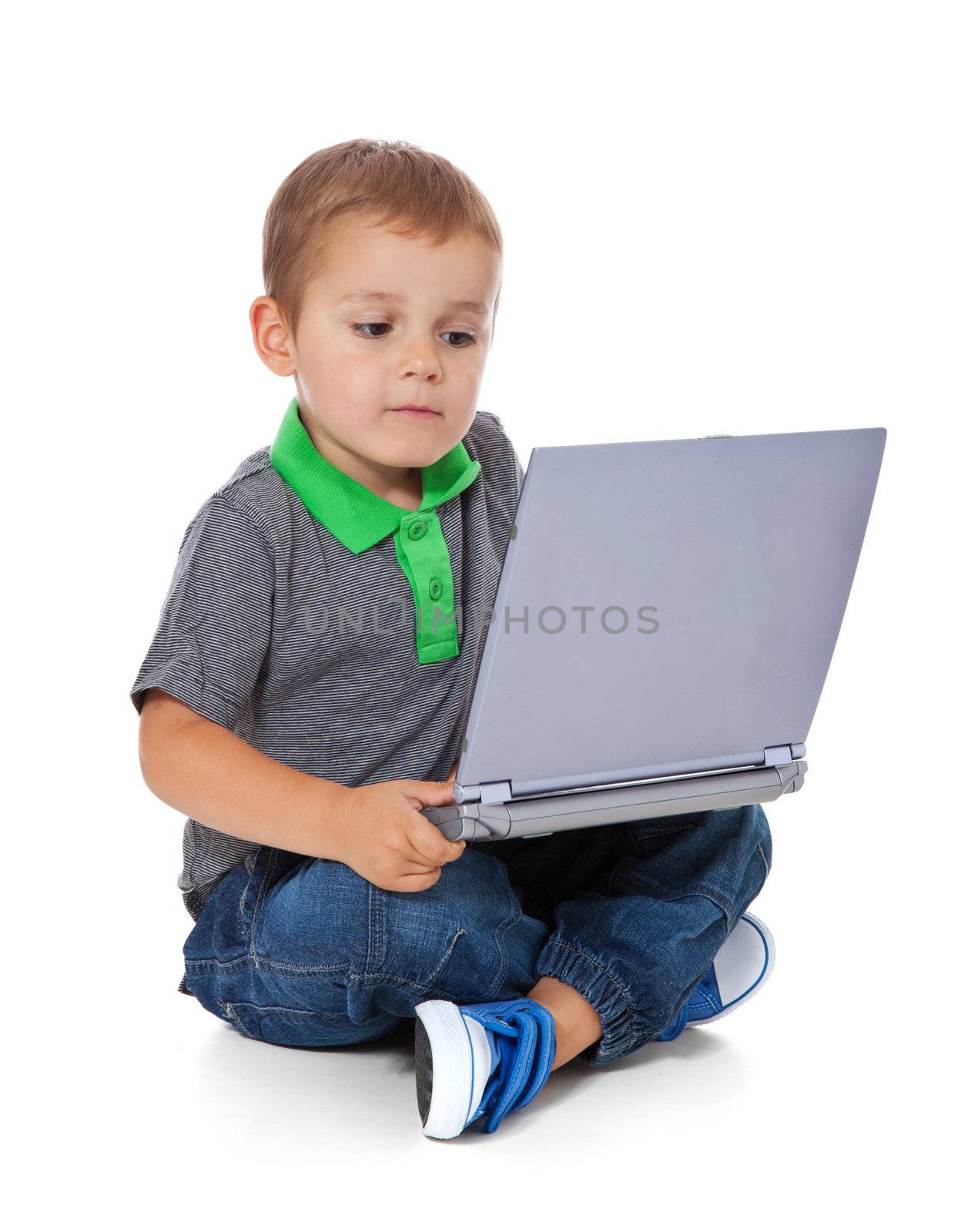 Boy using computer by kaarsten