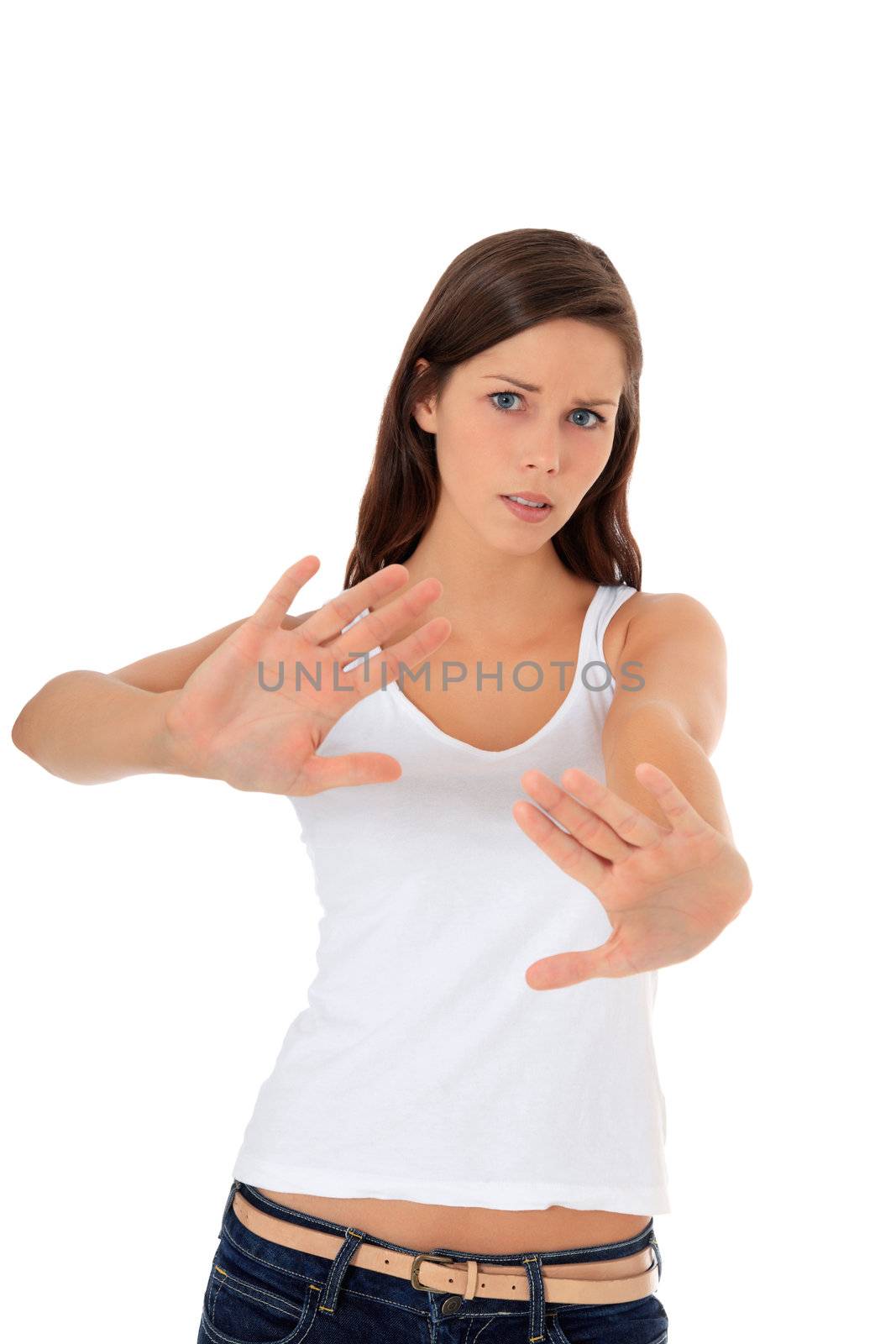 Attractive young woman making repelling gesture. All on white background.