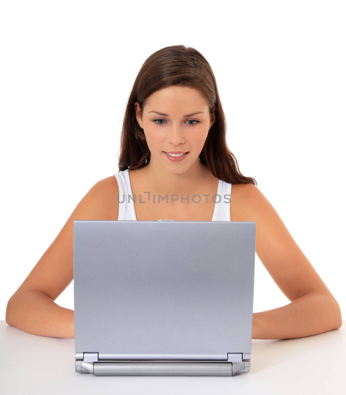 Attractive young woman surfing the internet. All on white background.