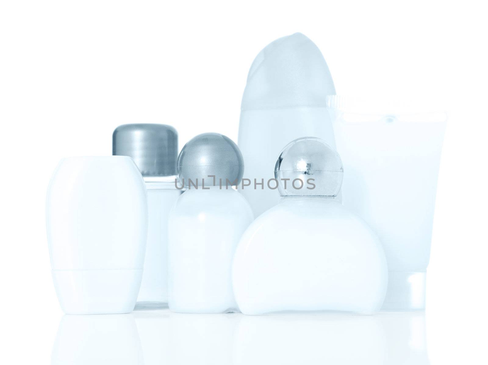 Various shampoo and lotion bottles. Blue tone. All on white background.