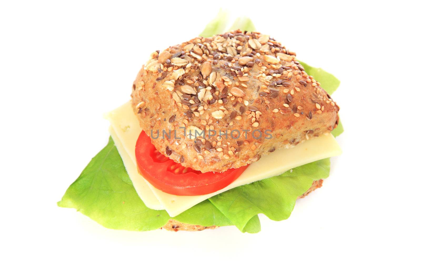 Multi-grain roll with cheese and lettuce. All on white background.