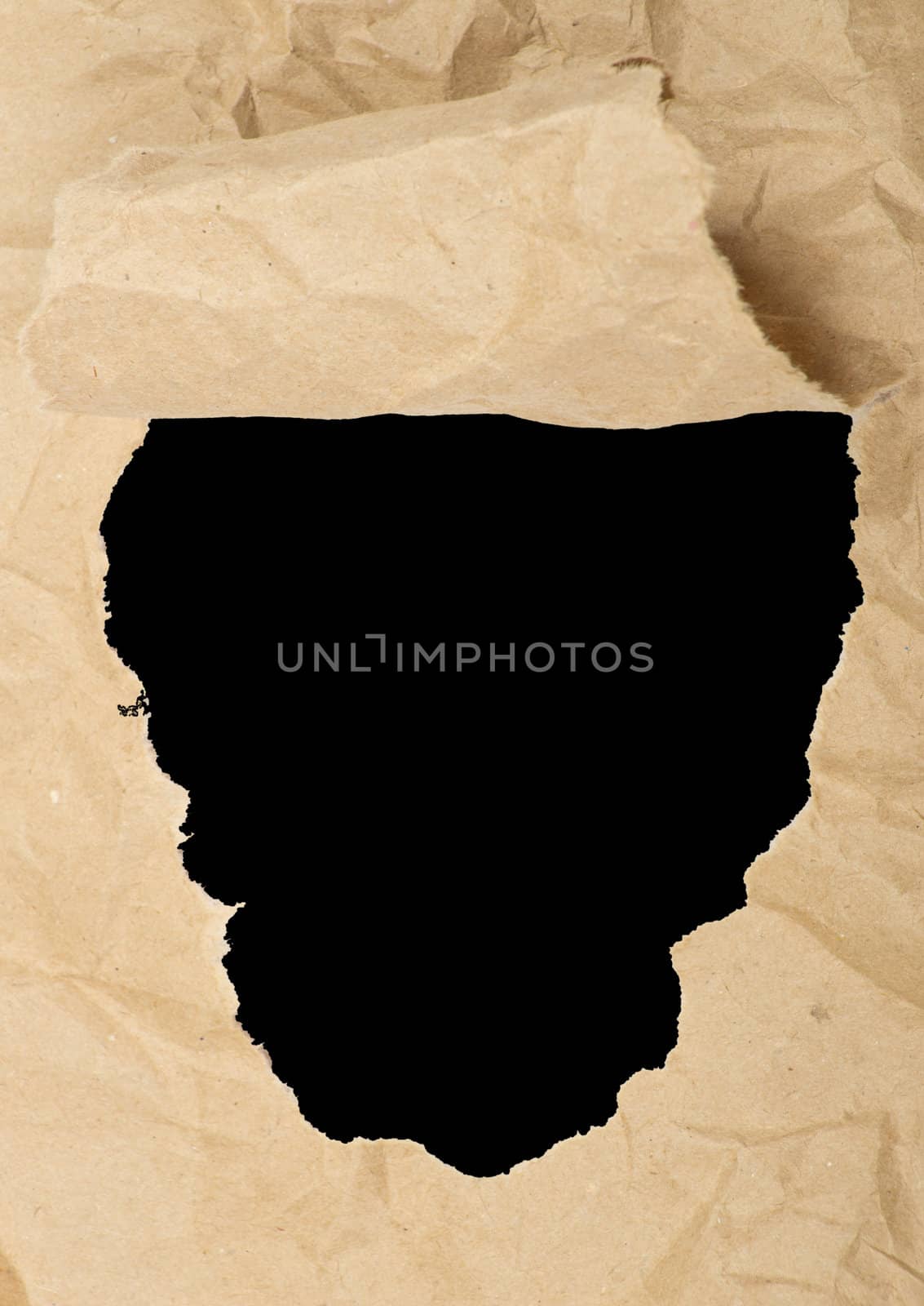 ripped white paper against a black background