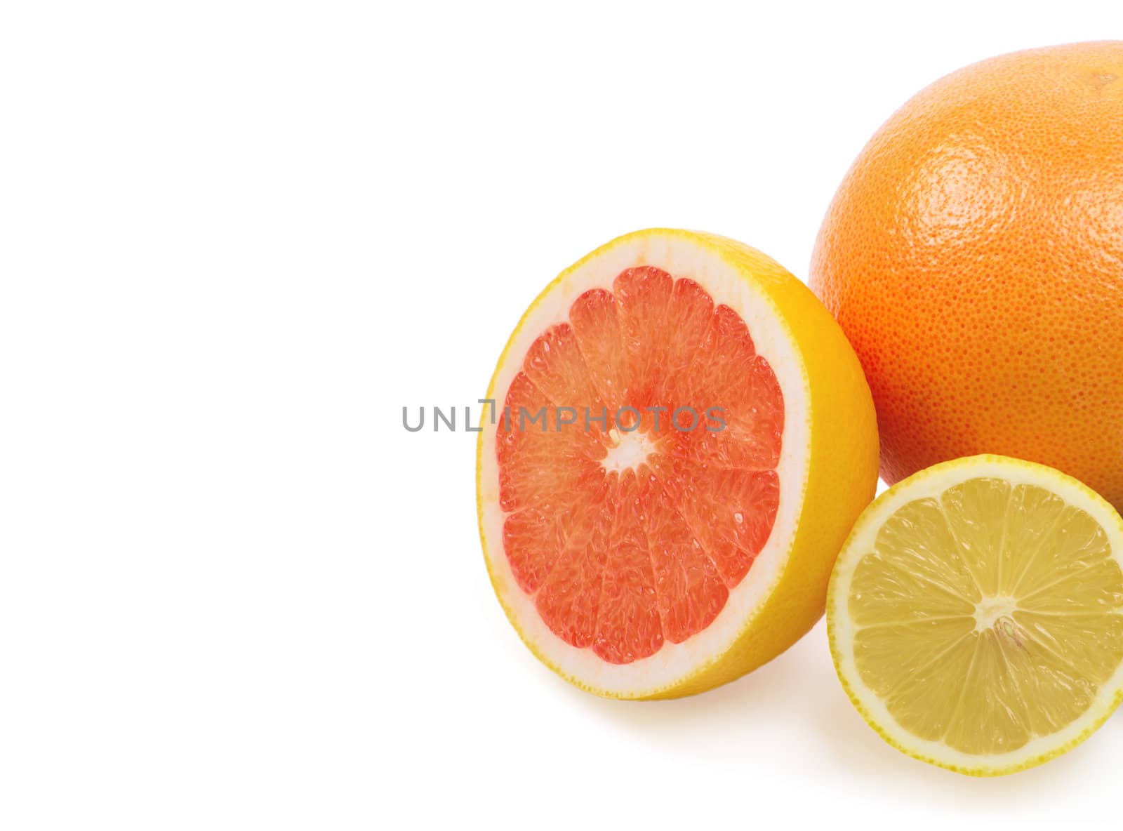 Image of a fresh whole lime, lemon and orange isolated on white