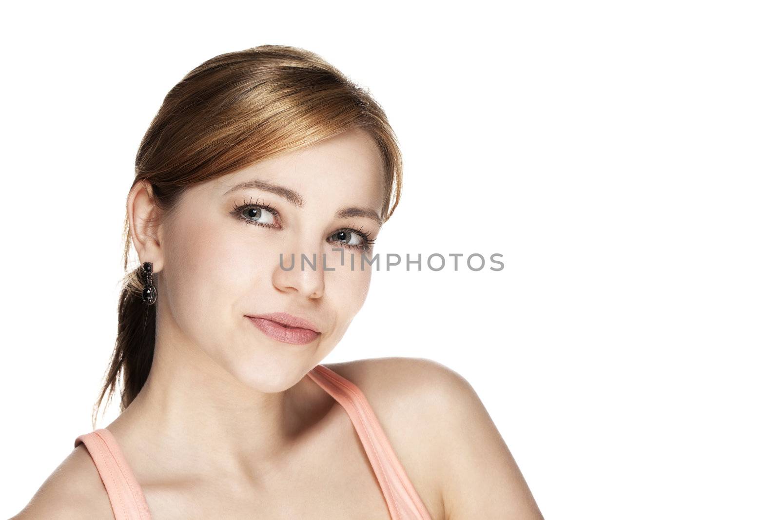 portrait of a young beautiful blonde woman looking to side on white background