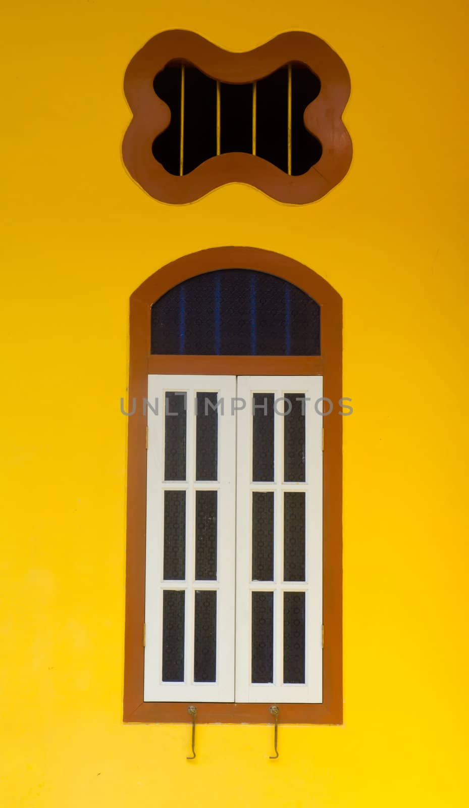 old window in phuket, thailand