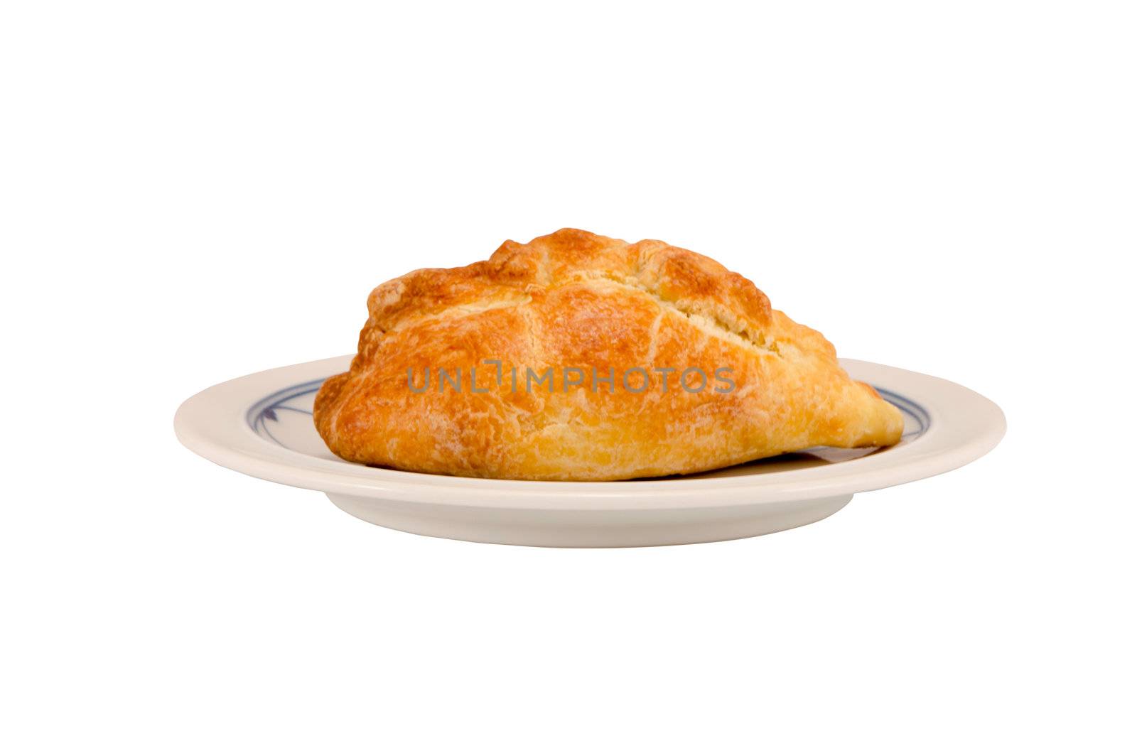 Karaite pastry stuffed with chopped lamb in dish isolated on white background.