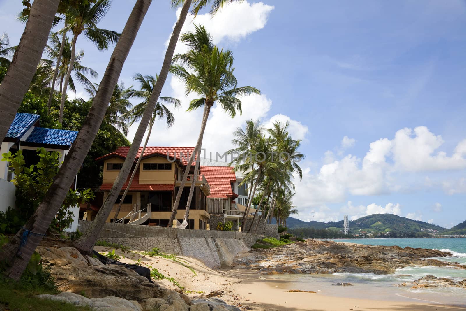 Modern hotels among the palms on the beach. Phuket. Patong.