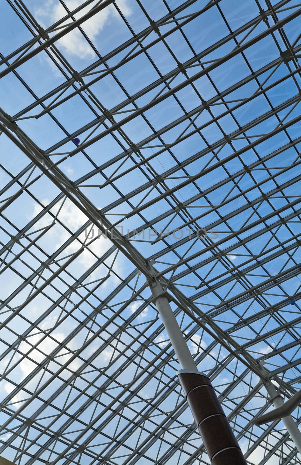glass roof of a modern building and blue sky by Serp
