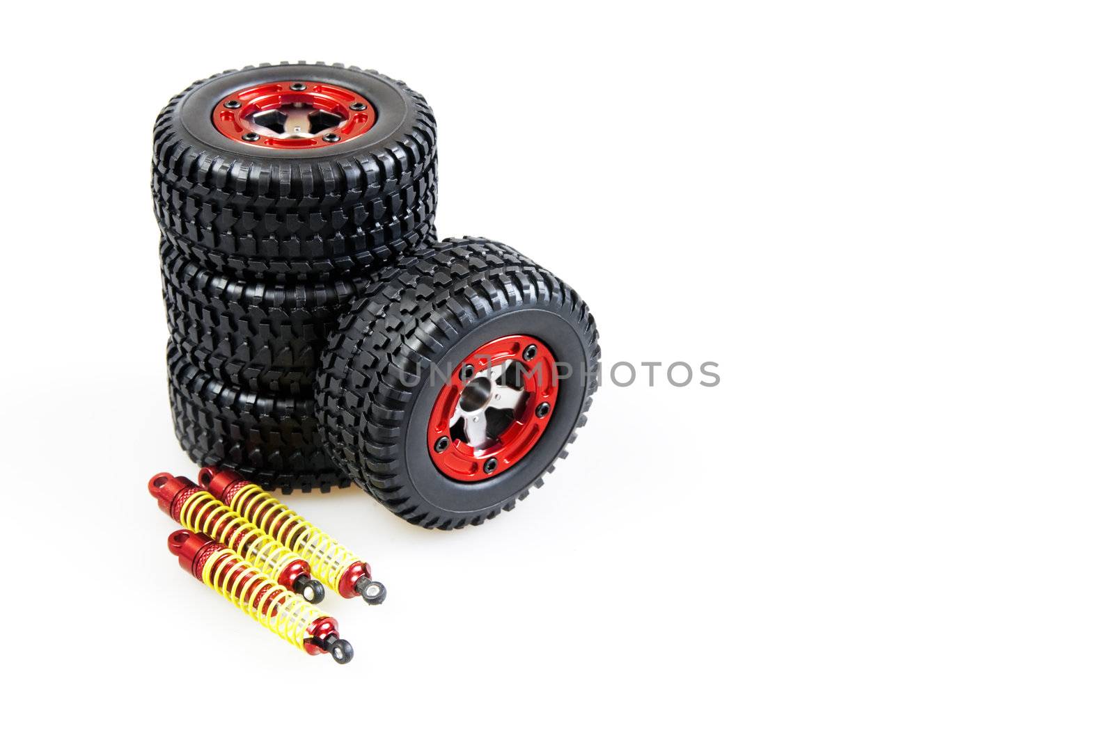 shock-absorbers and wheels of rc car on a white background
