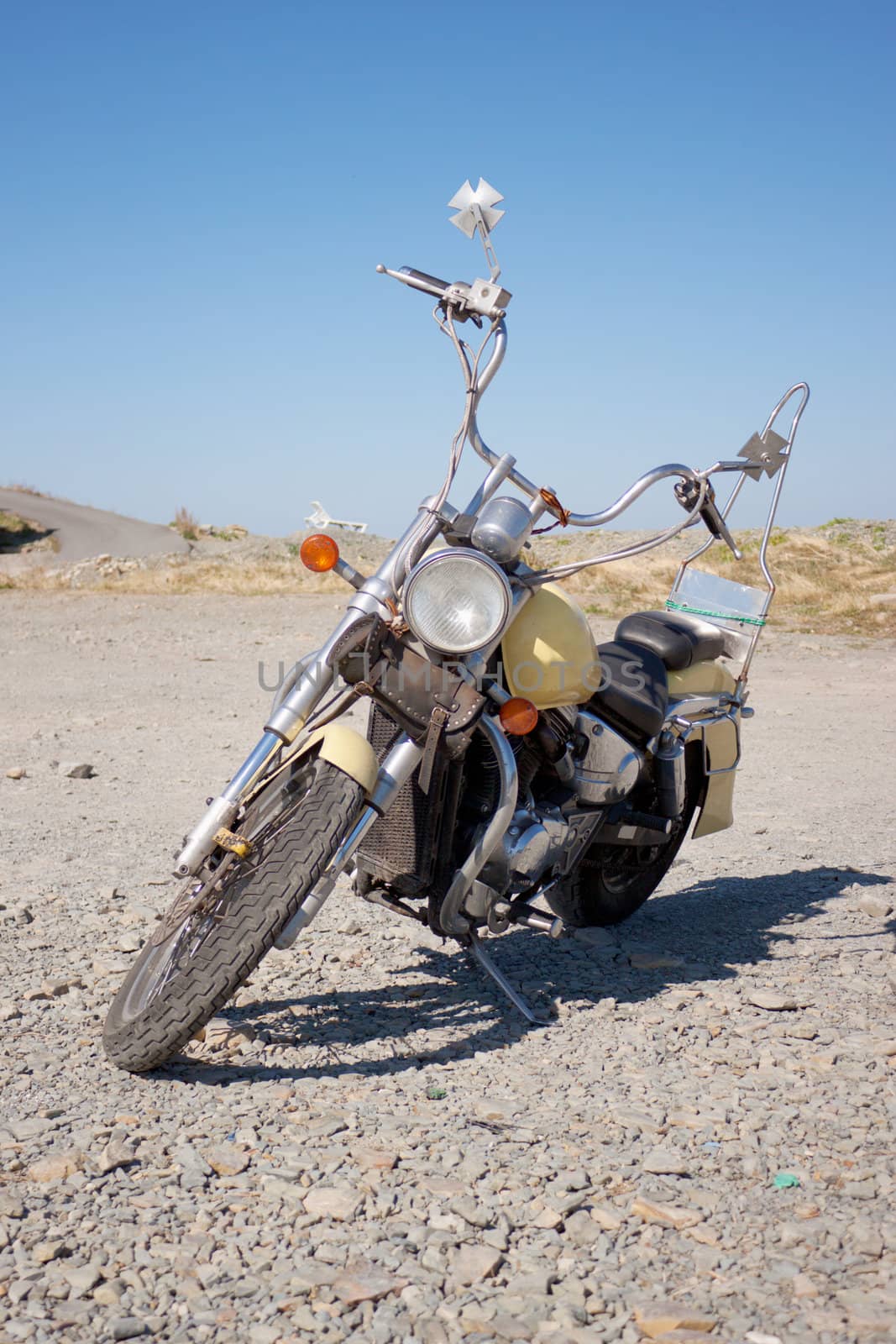 Old motorcycle is in a vacant lot