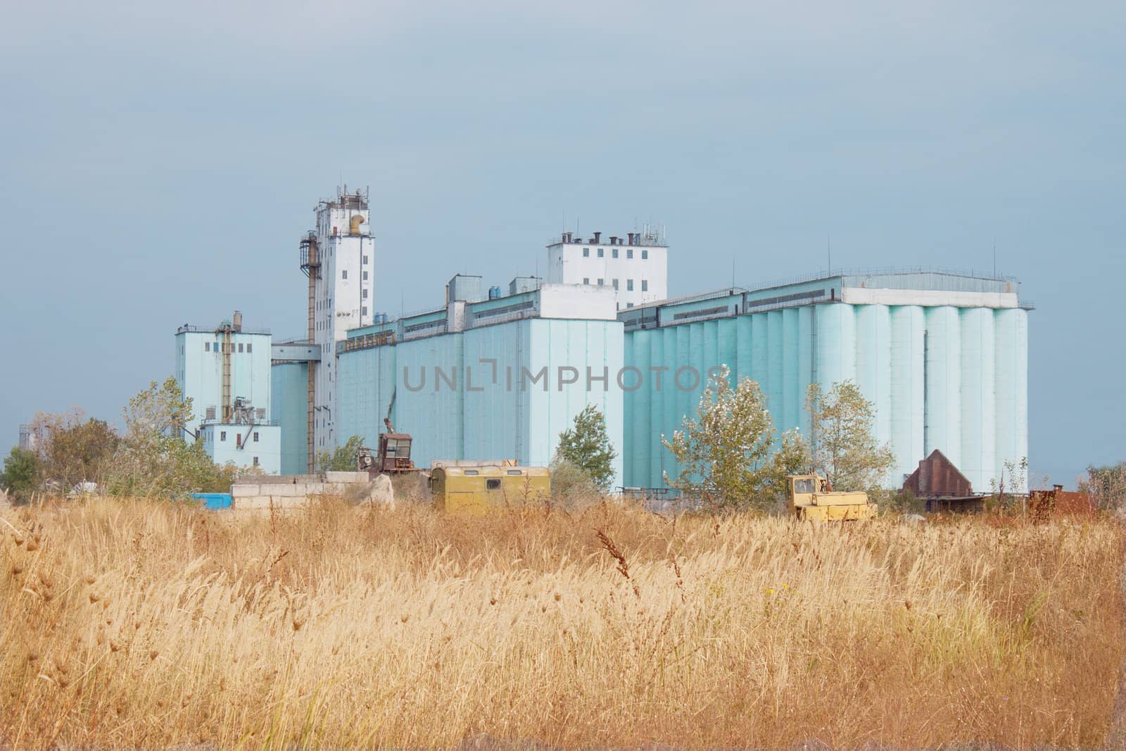 Large grain elevator rises among the steppe