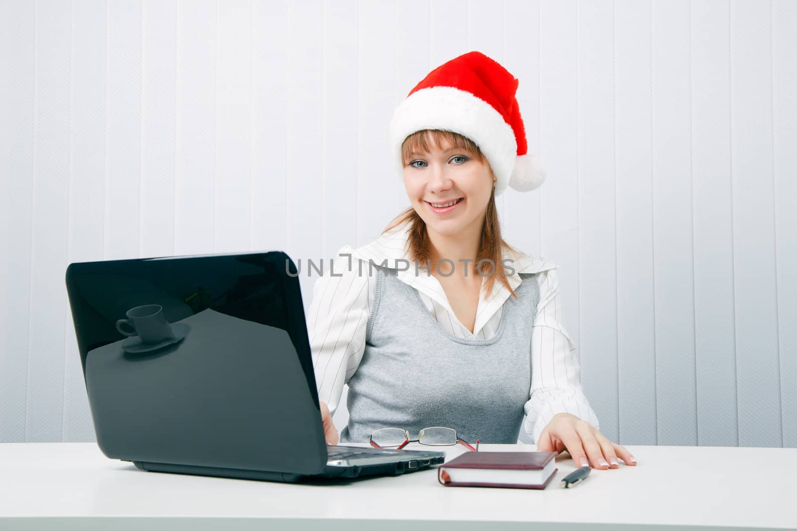 attractive business woman in Christmas hat by pzRomashka