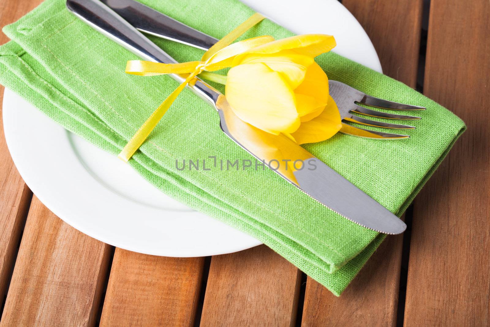 Fork and knife and plate, served for dinner