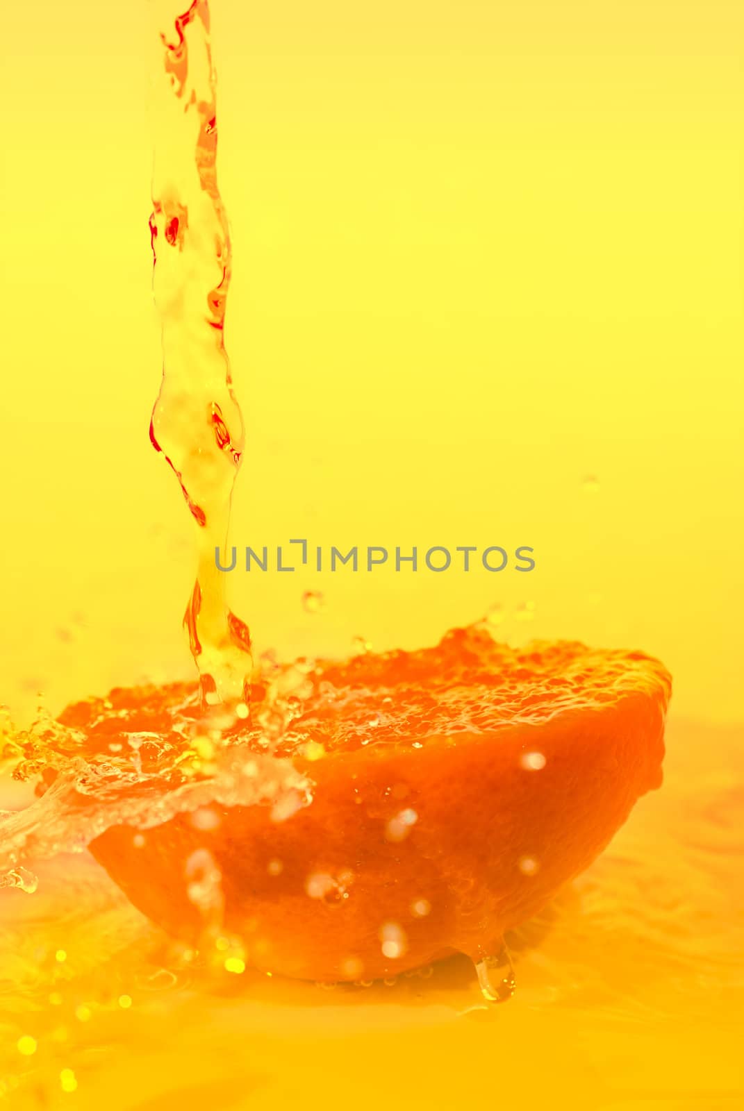 Orange slice with pouring juice, healthy concept