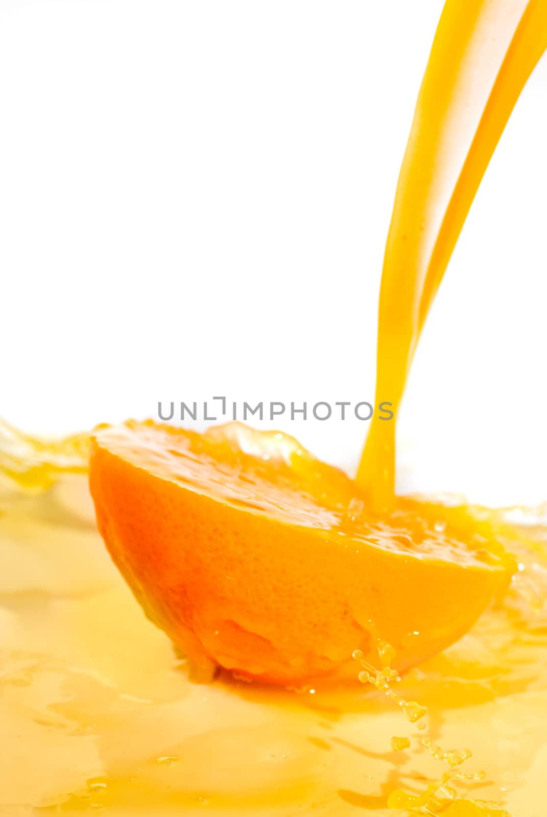 Orange slice with pouring juice, healthy concept