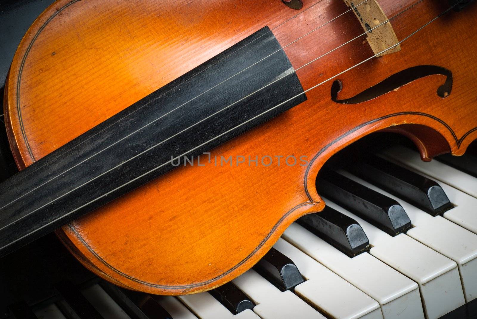 Violin and piano keyboard closeup part fot music background