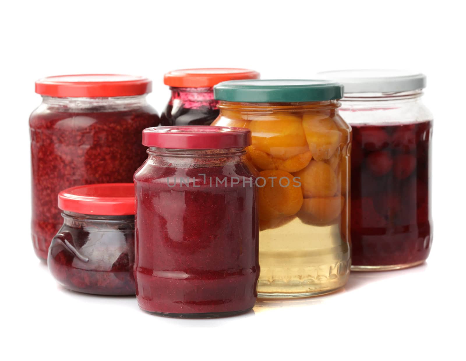 Sweet preserves as jams and compotes isolated on white