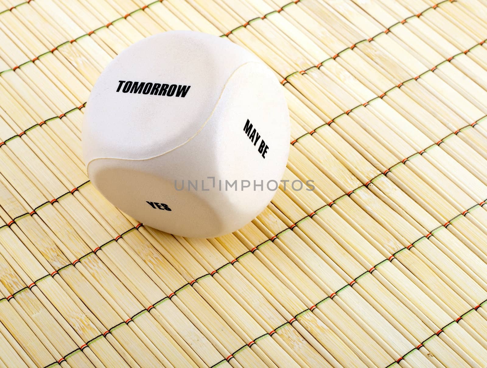 business dice with words on bamboo place mat