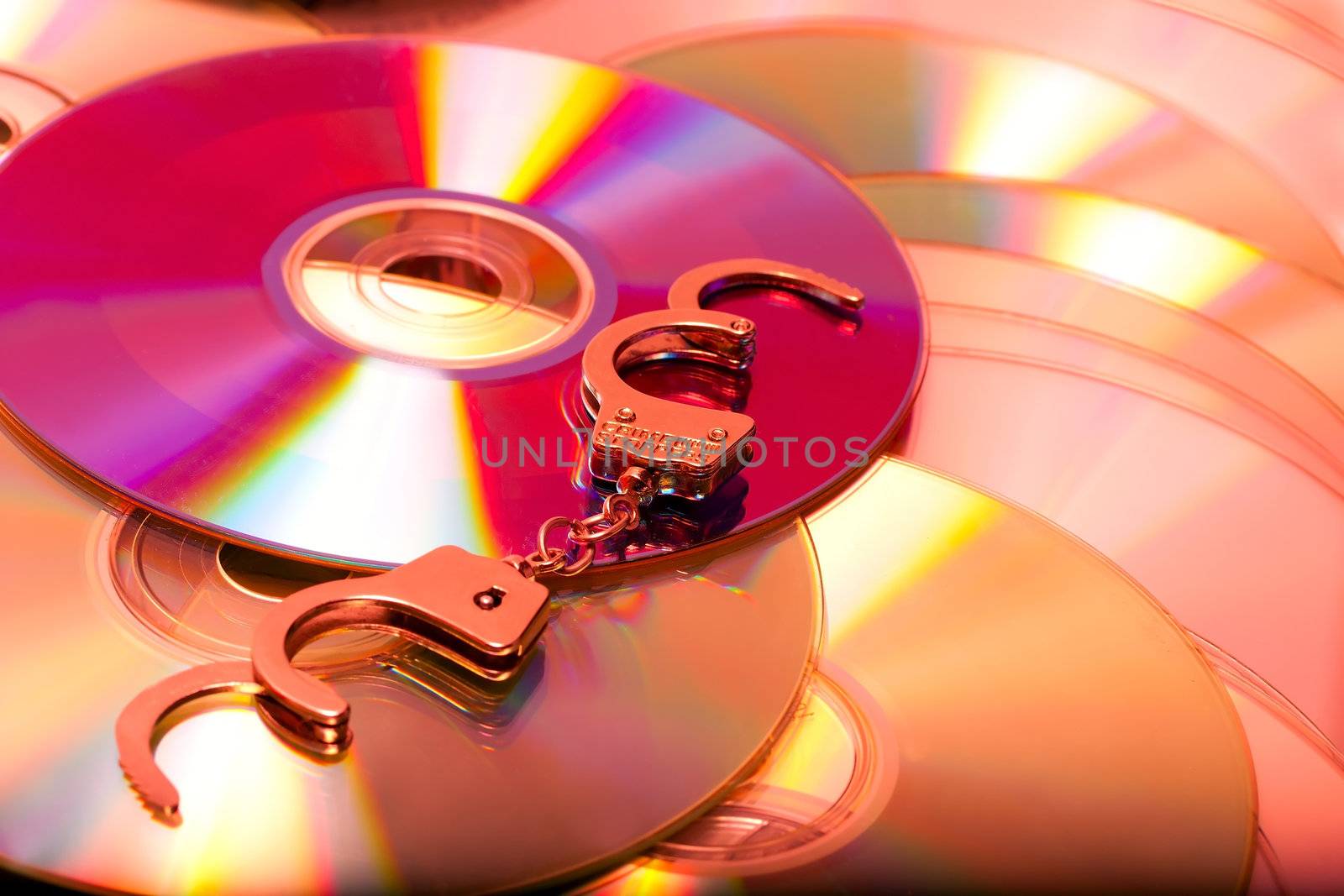 handcuffs in pile pirate dvd computer disc