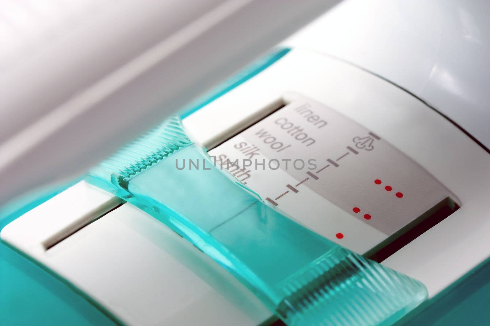 electric iron temperature control on a white background