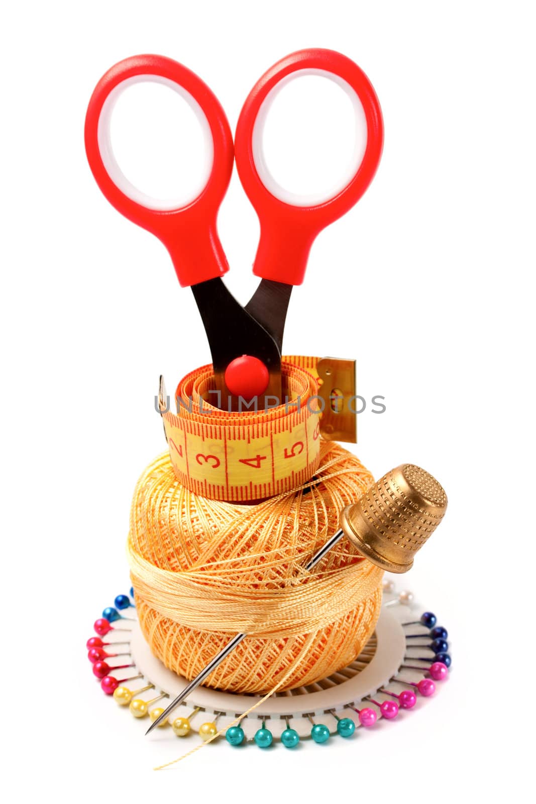 needles, threads, bobbins, scissors, tape measure, thimble isolated on white background