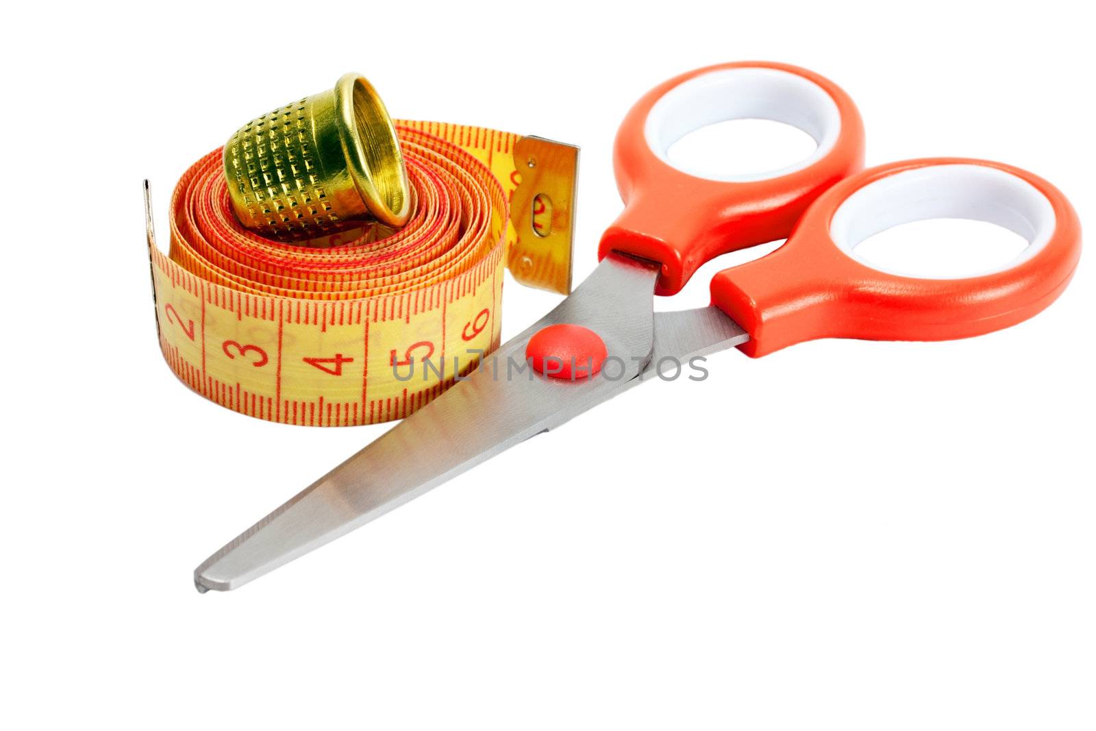 scissors , thimble and measuring tape isolated on white background