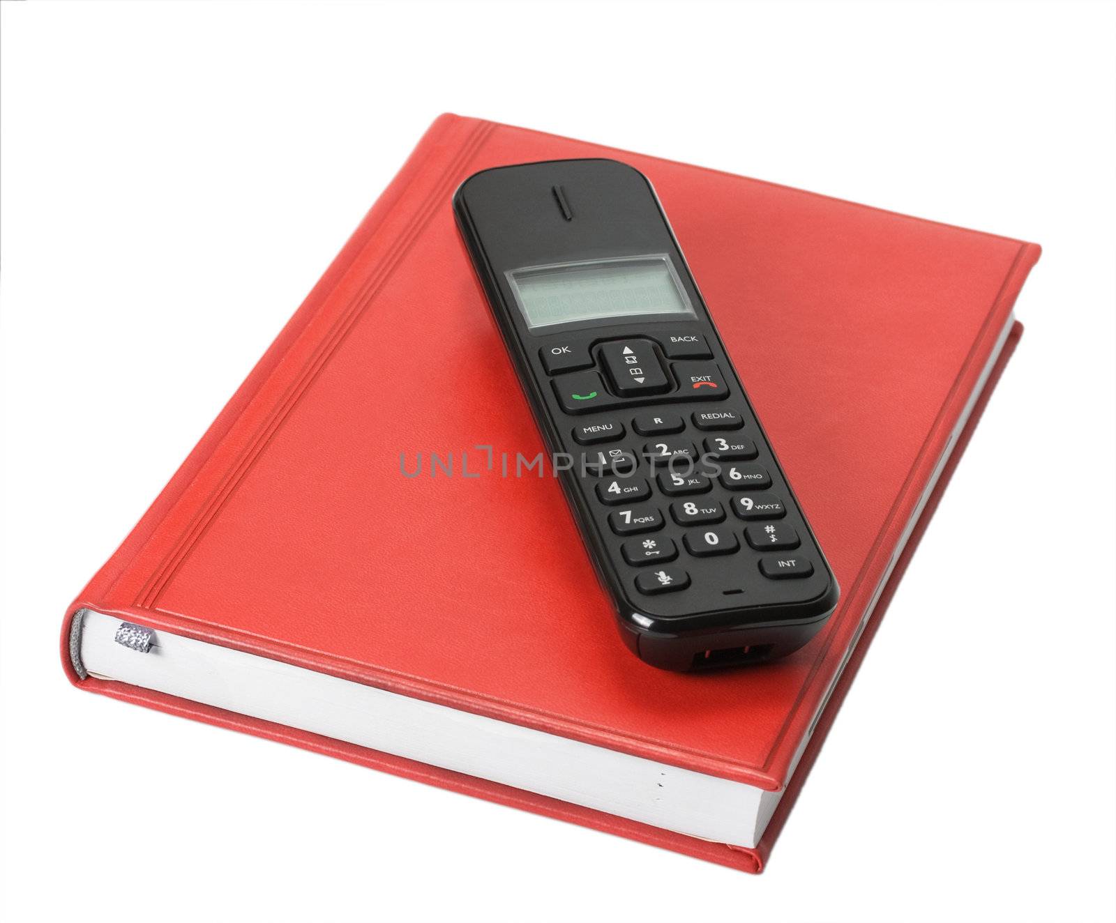 Black phone on red organizer isolated on white background