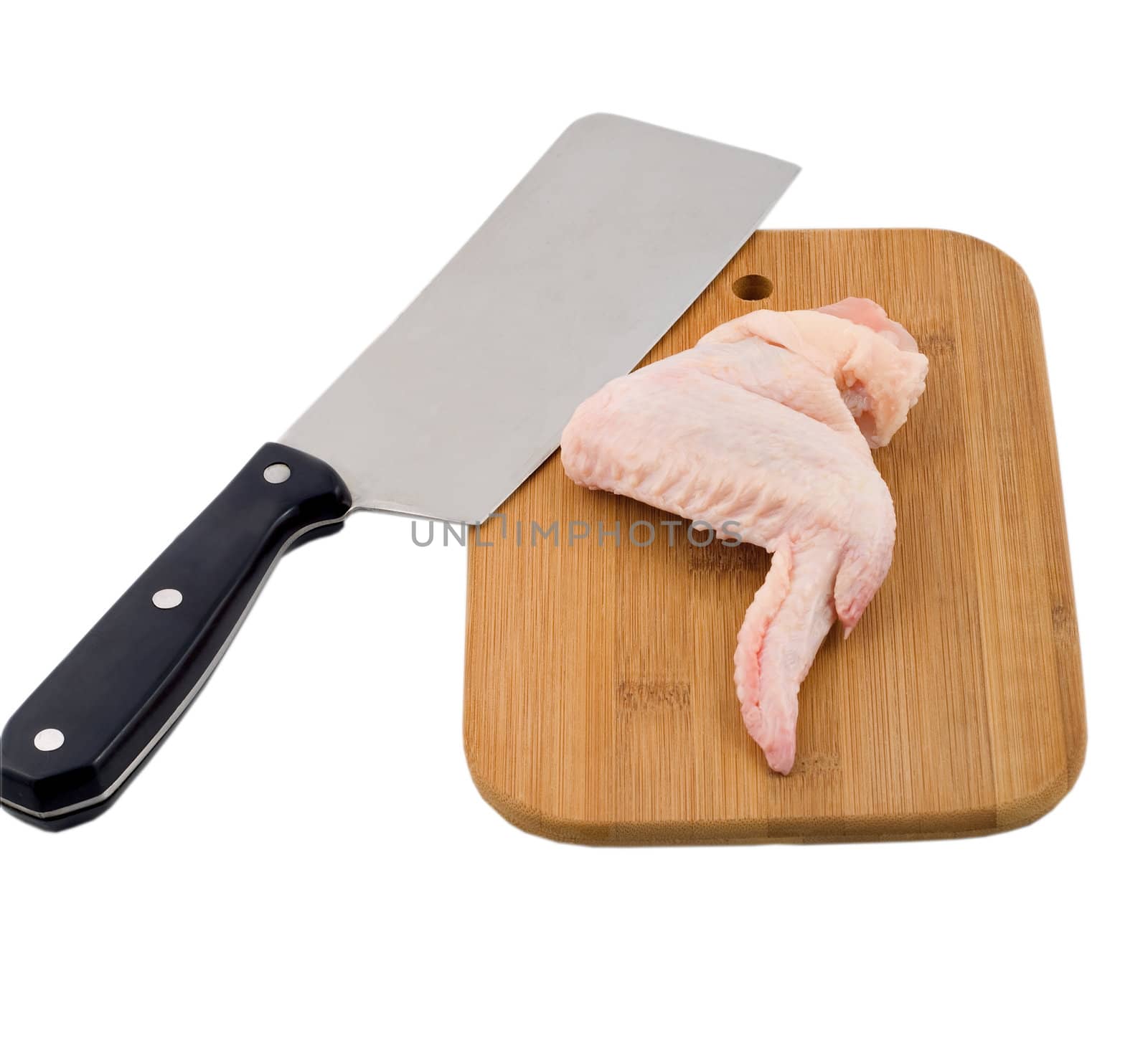 Raw chicken wings on a wooden board isolated on white background