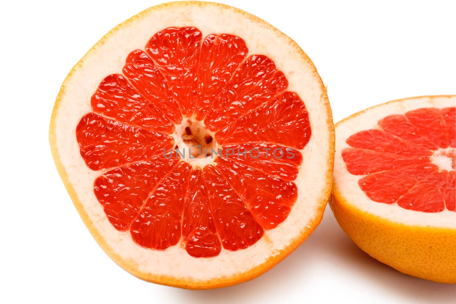 grapefruit slices close up isolated on white background