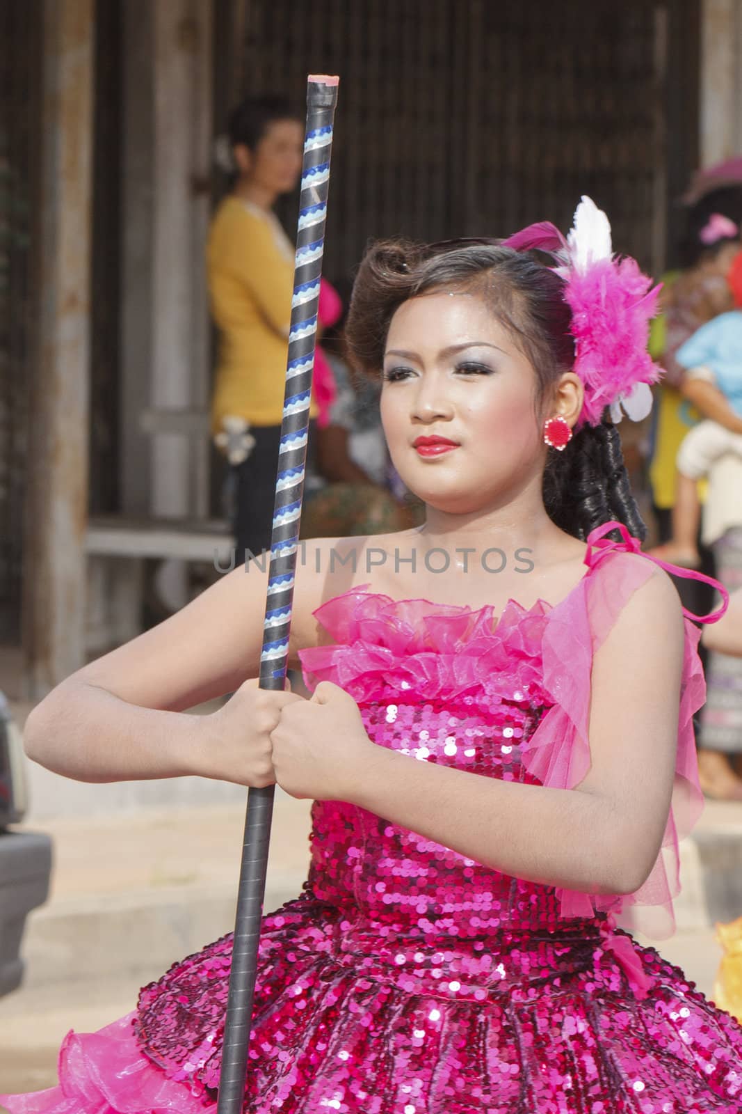 THAILAND - JULY 13: Miss Pirada Suwannarak Drum Major leads holding mace during Dokbual game school parade on July 13, 2012 in Suratthanee, Thailand.