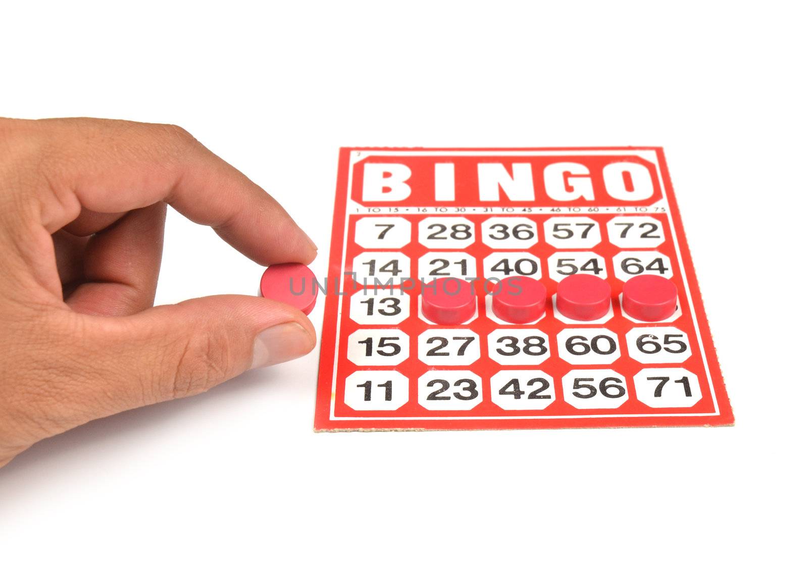 bingo card with hand hold wining chip