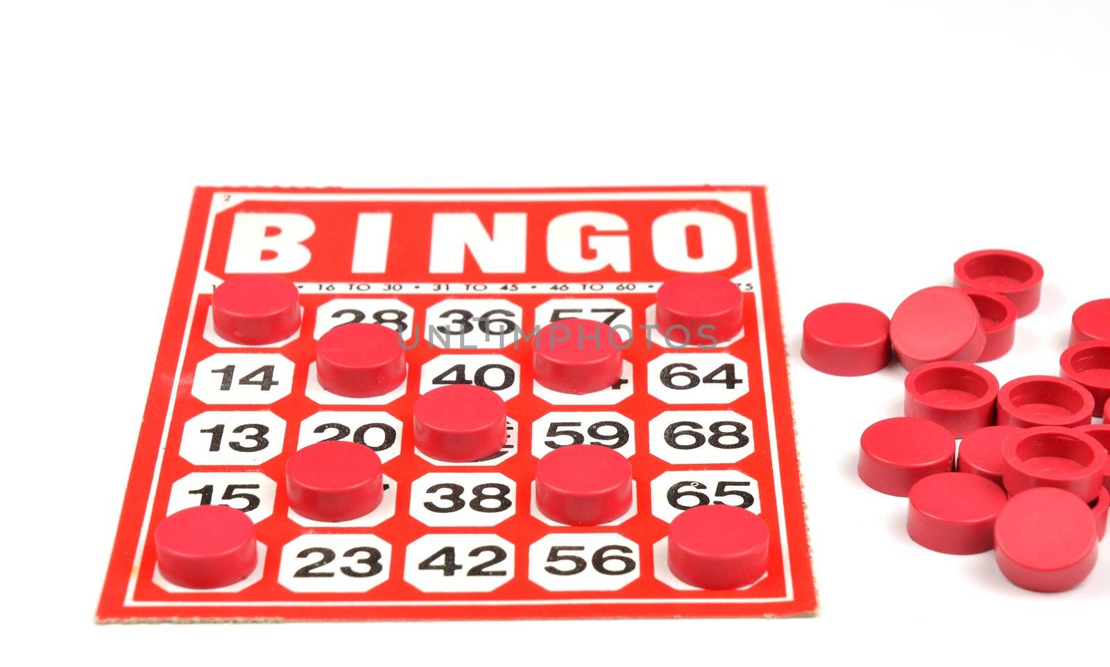 Red bingo card with winning chips 
