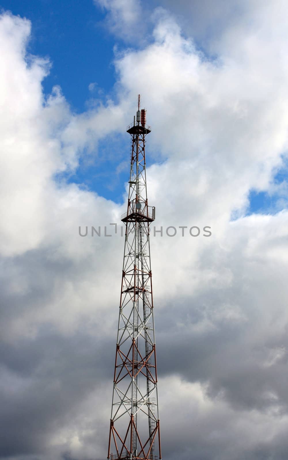 telecommunications tower on background sky cloud