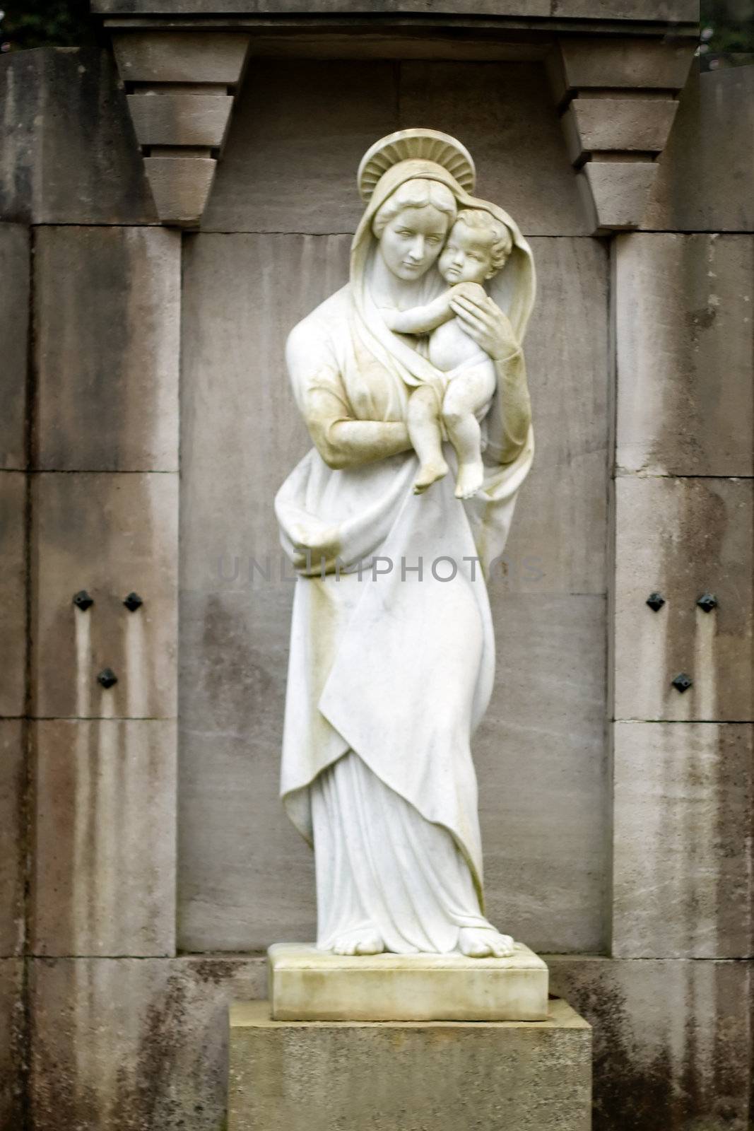Statue of the virgin Mary carrying the baby Jesus