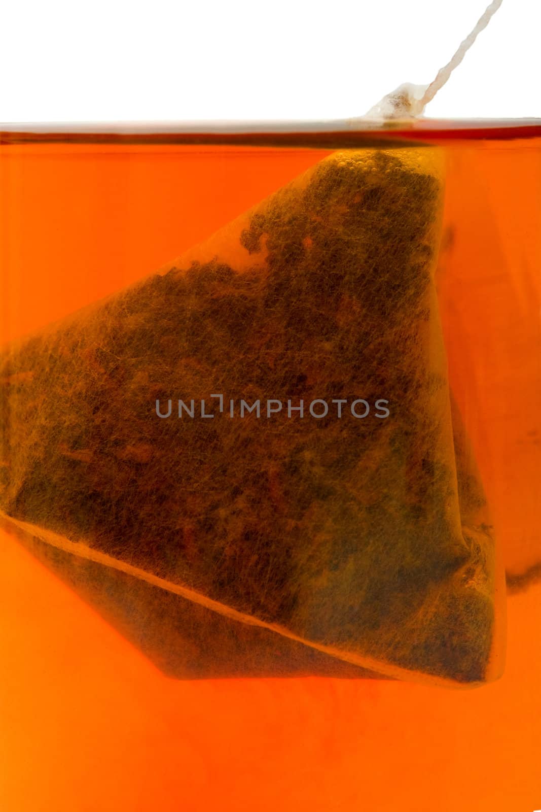 Hot tea with a tea bag filter background.