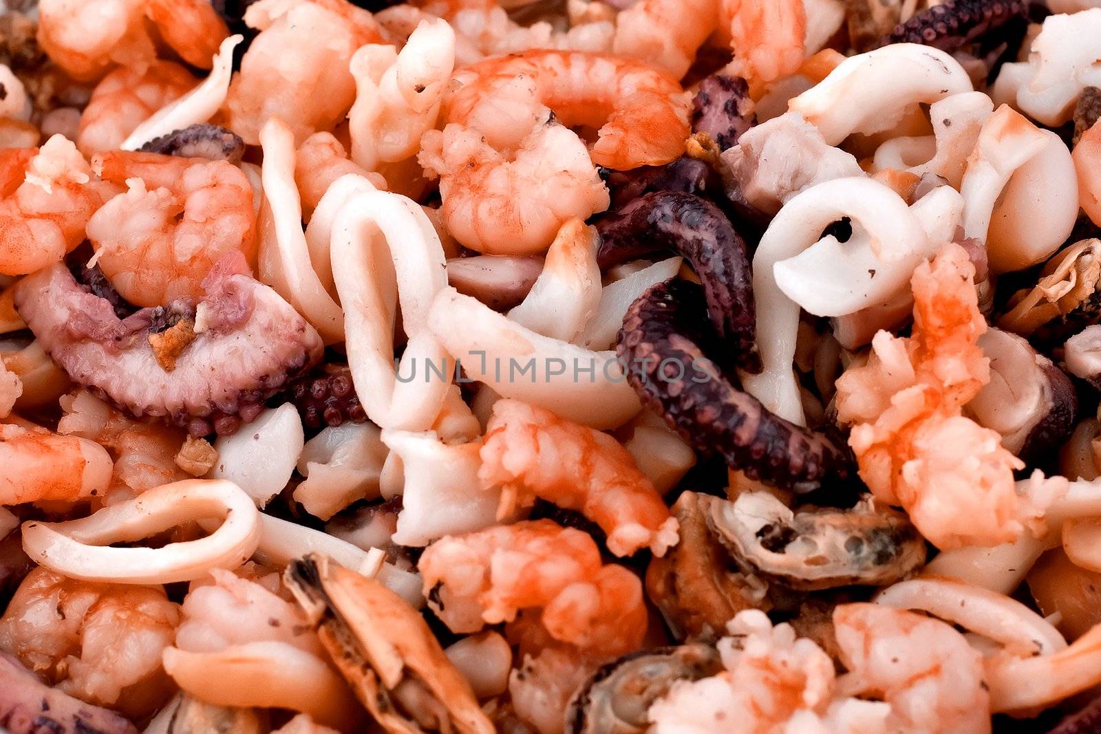 seafood salad with prawns , squids , oysters and mussels