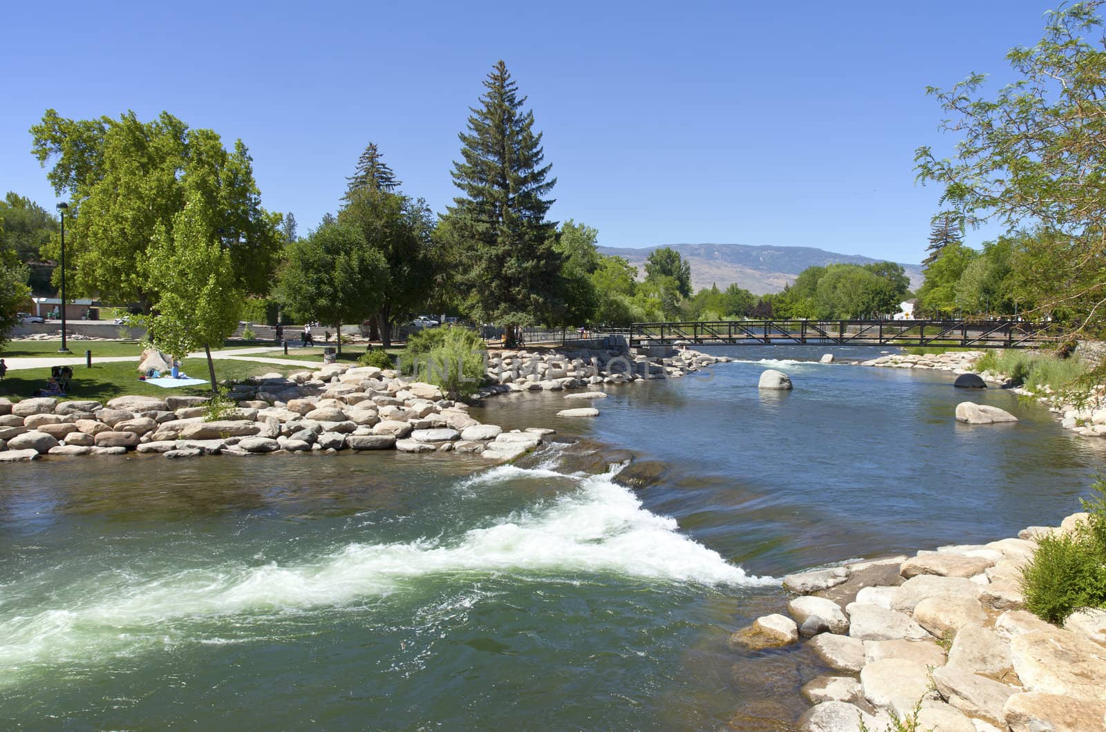 Park and river near downtown Reno, NV. by Rigucci