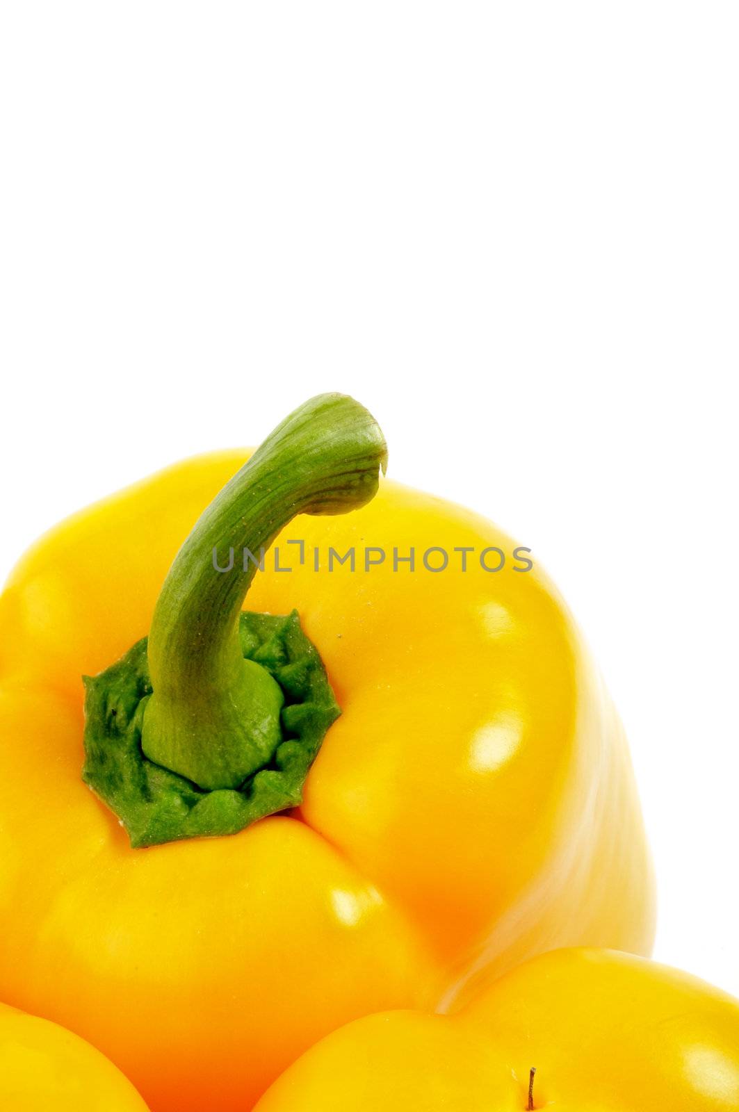 Yellow Bell Pepper with fresh tail close up on white background