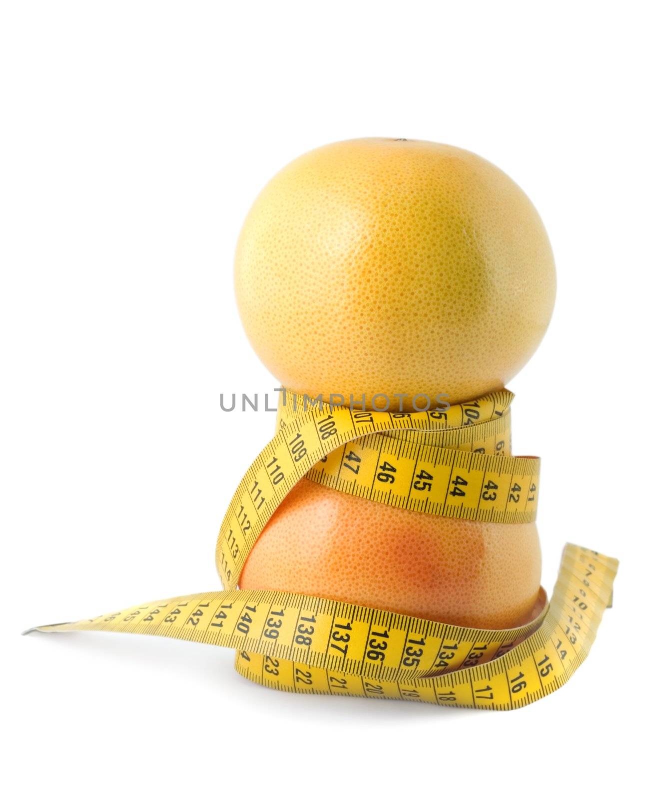 grapefruit and measuring tape dieting concept isolated on white background