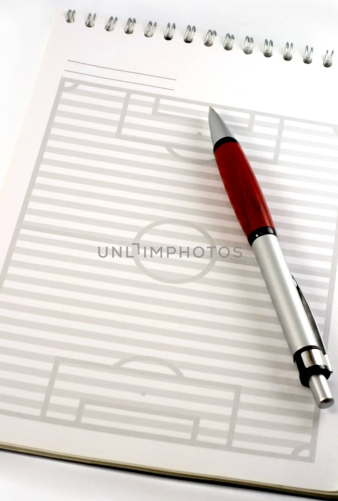 red pen and pad is strategy football field
