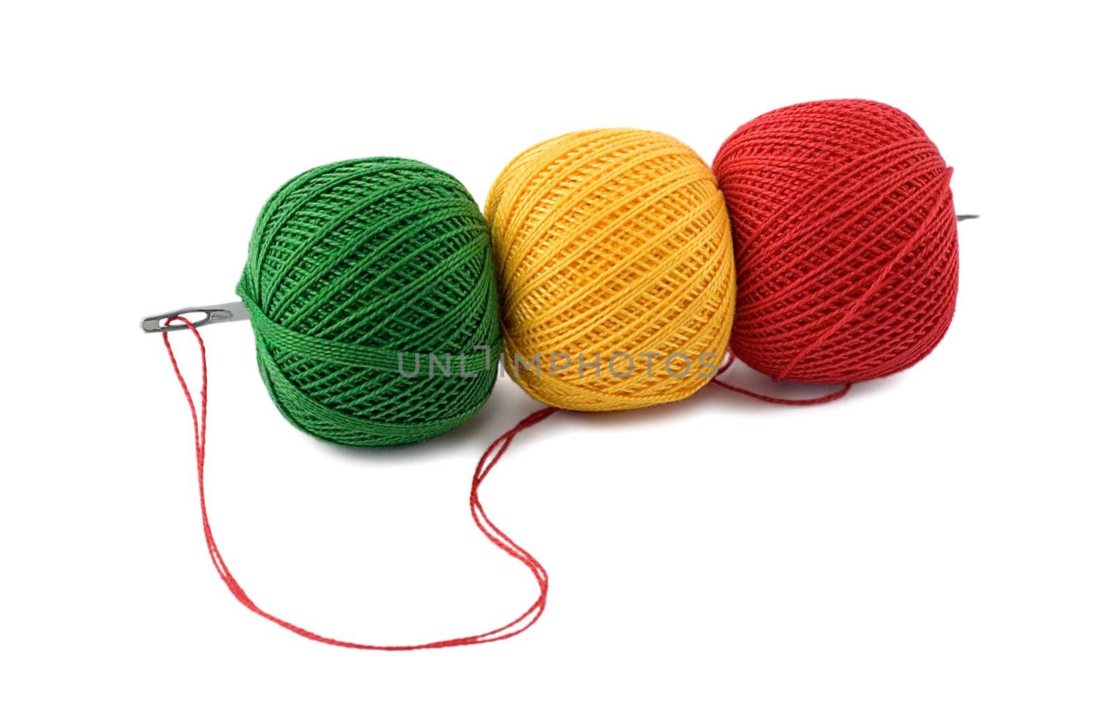 needle in embroidery threads isolated on white background.