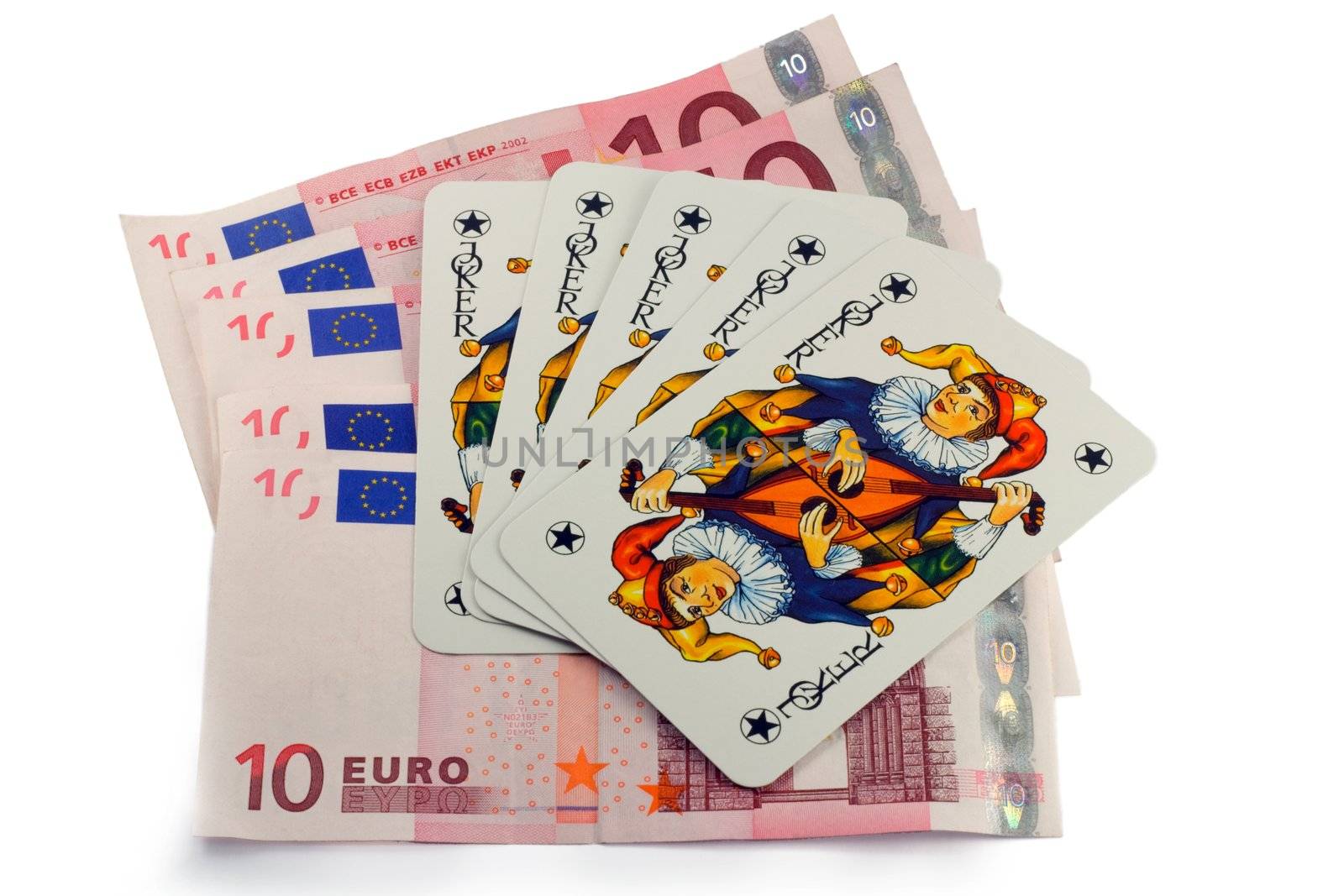 Five card jokers are resting on 10 euro bills.
isolated on a white background