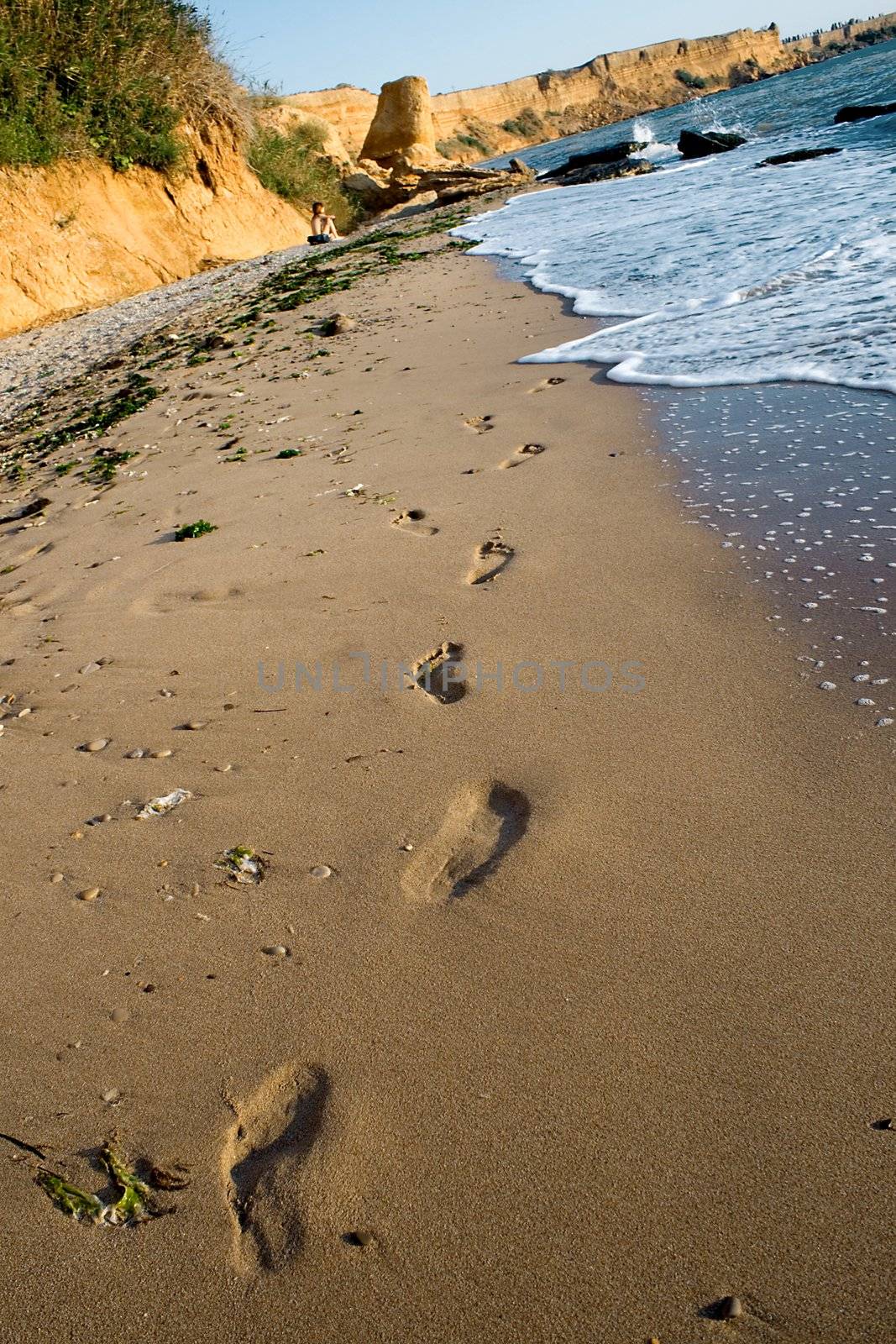 Foot steps in sand beach
