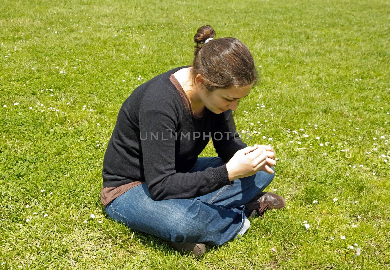 woman dreaming in a field of daisies