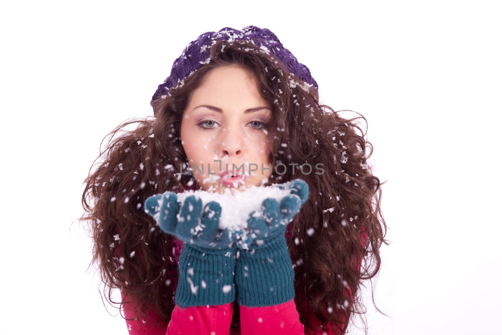beautiful smiling brunette woman in snow in winter  isolated on white background