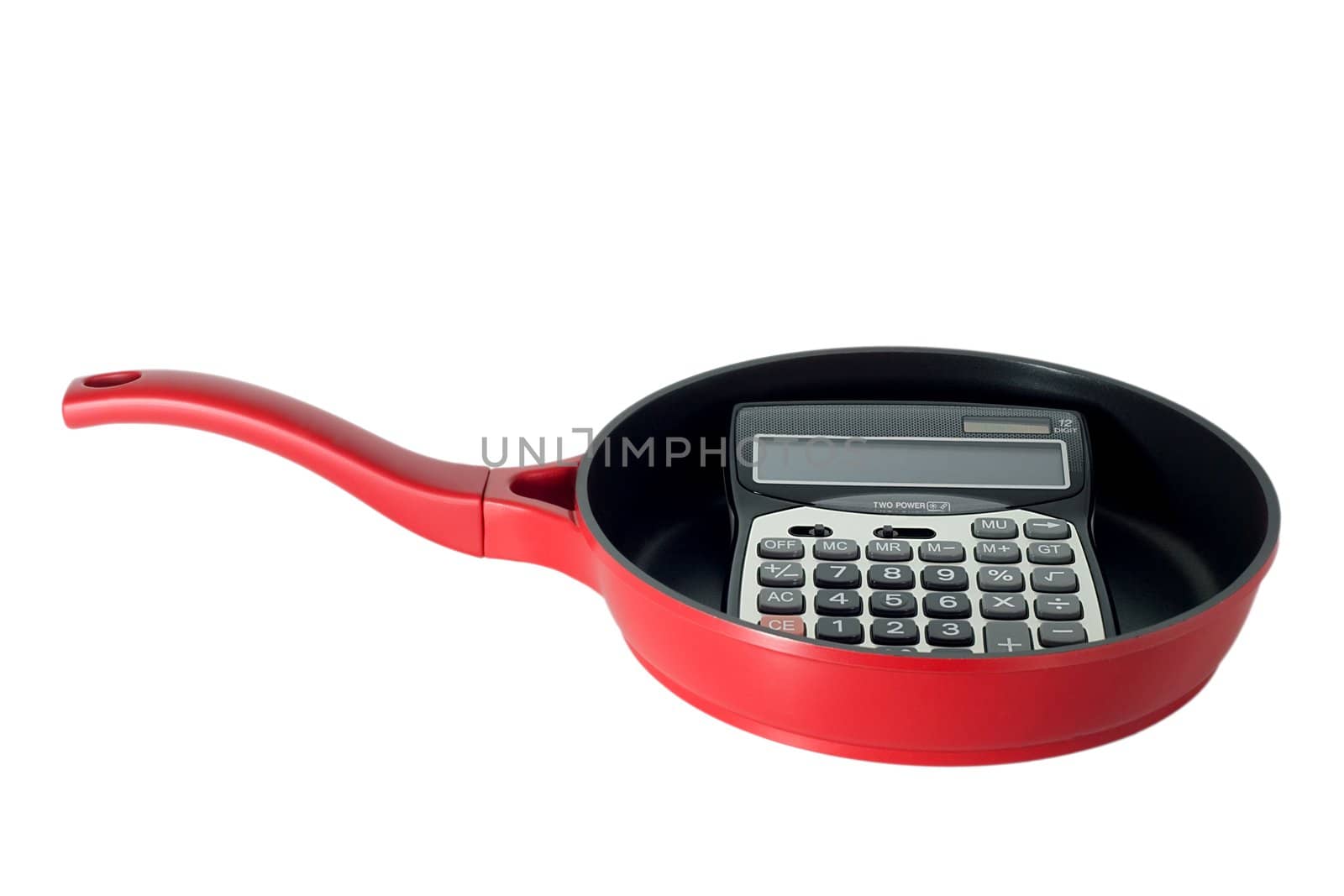 calculator in frying pan isolated on white background