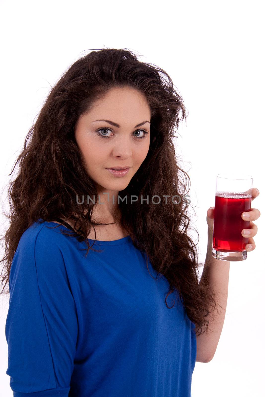 beautiful smiling brunette woman is drinking red juice isolated on white